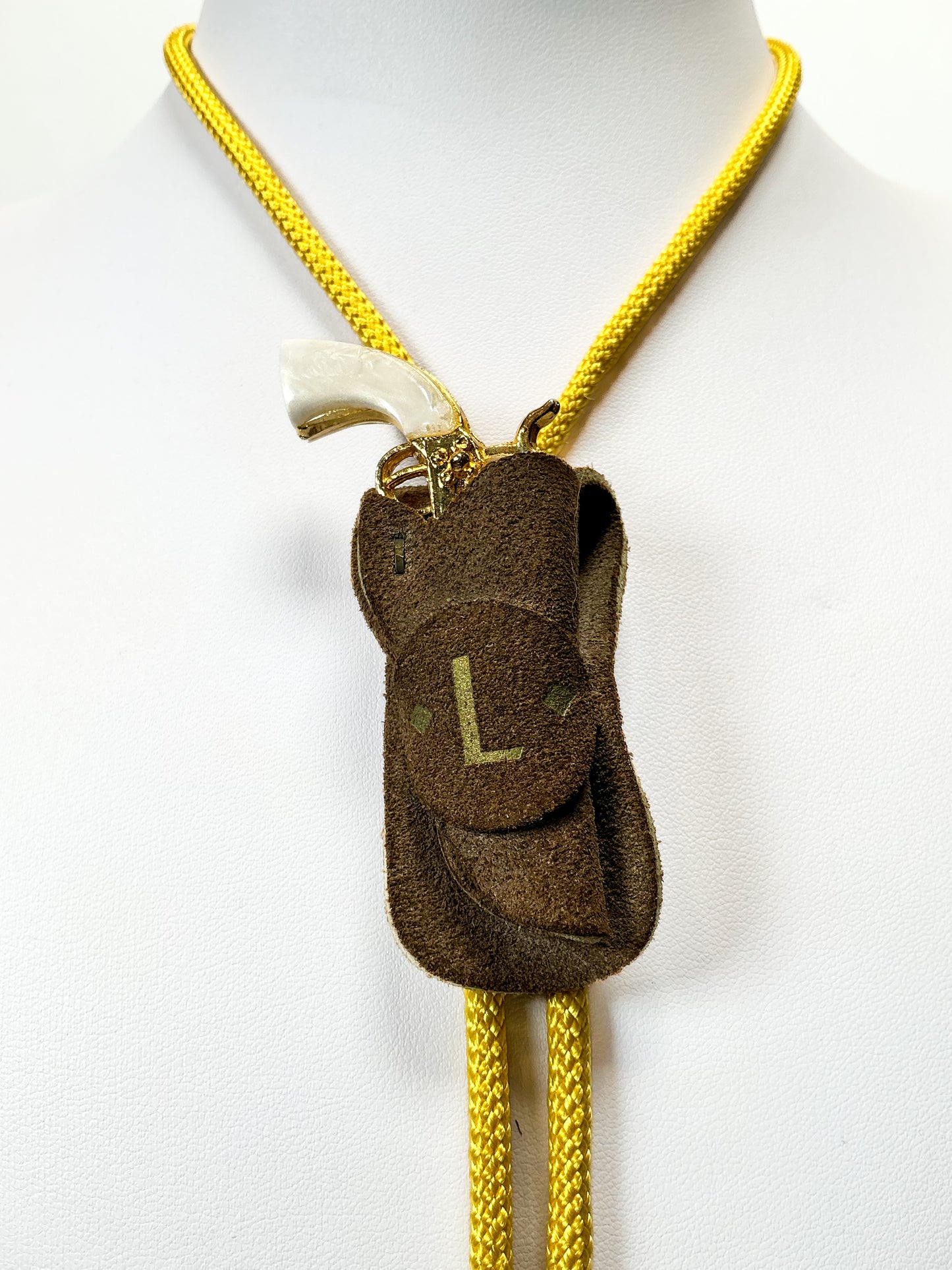 Vintage Accessories - Bolo Tie - Miniature Gold Pistol in Holster - Yellow Braided Cord - Brass Tips