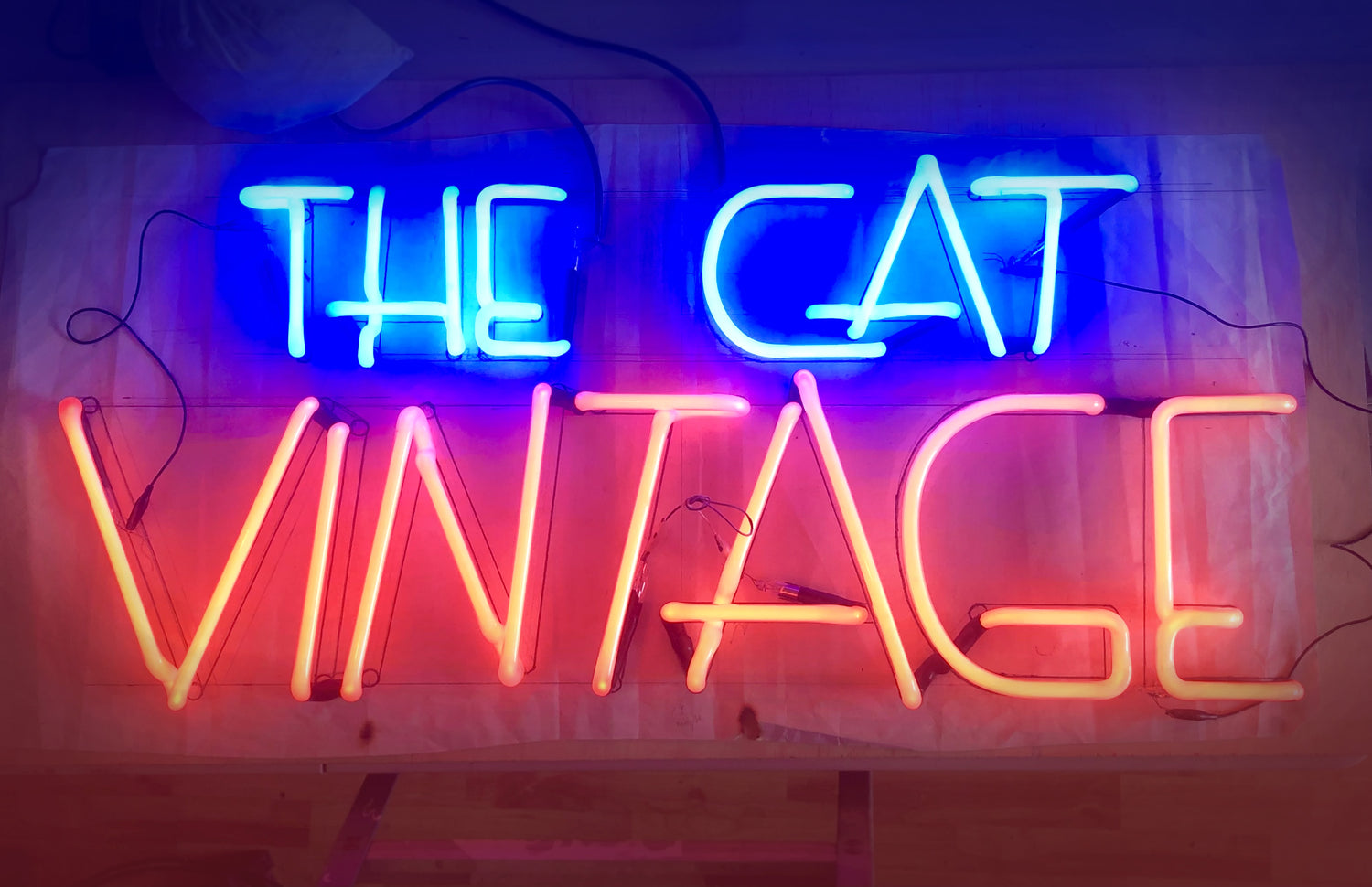 The cap vintage neon sign by Bill Concannon