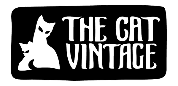 The cat vintage logo shows a hand drawn lettering and image of a tv lamp cat
