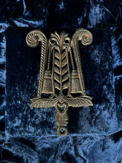 Vintage Iron Wilton Trivet - Brooms, Foliage, and Heart Motif