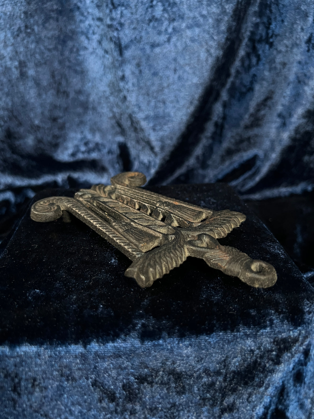 Vintage Iron Wilton Trivet - Brooms, Foliage, and Heart Motif