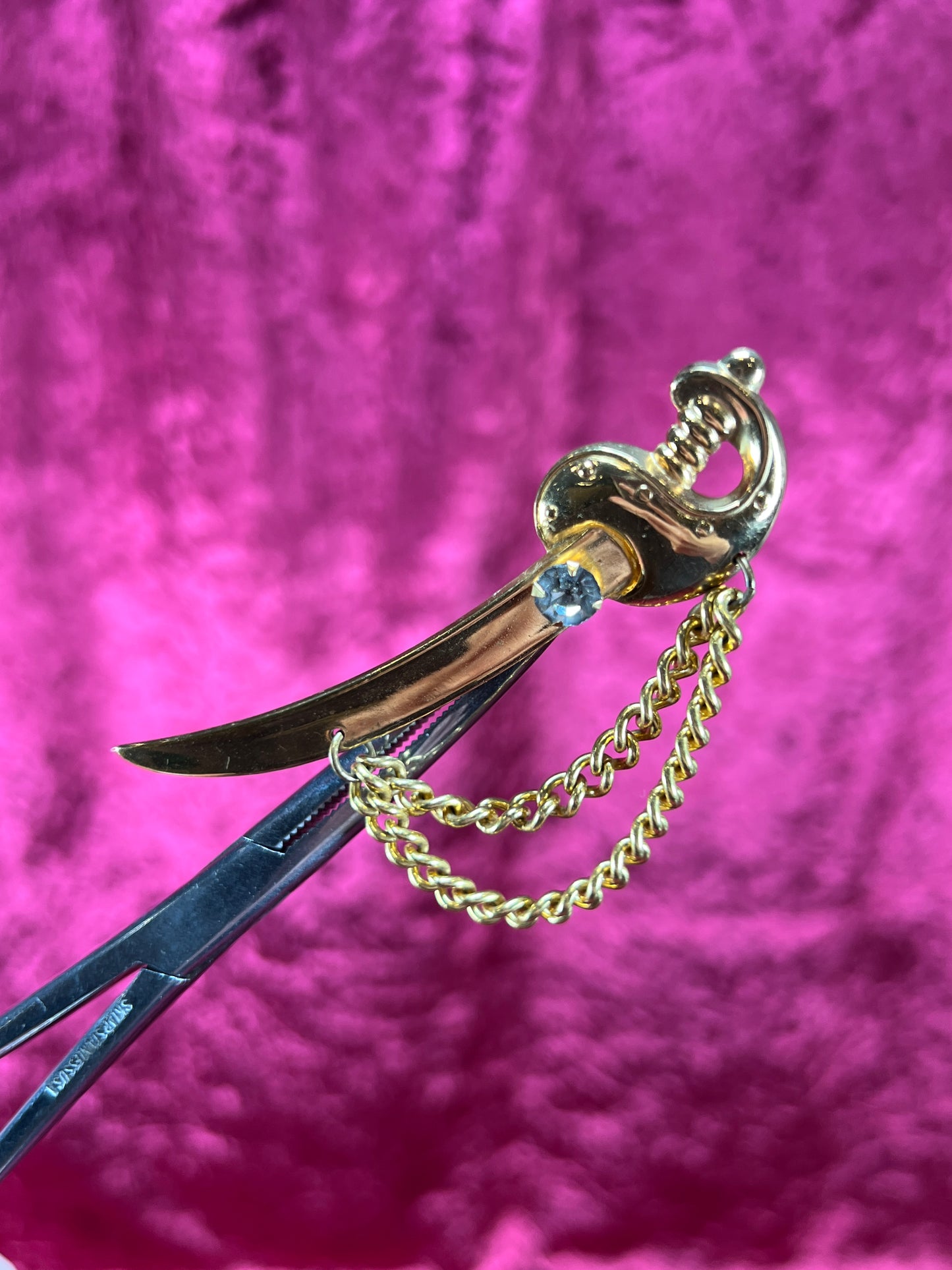 Vintage Jewelry - Brooch - Gold Tone Scimitar Sabre / Sword - Clear Rhinestone Center - Coro