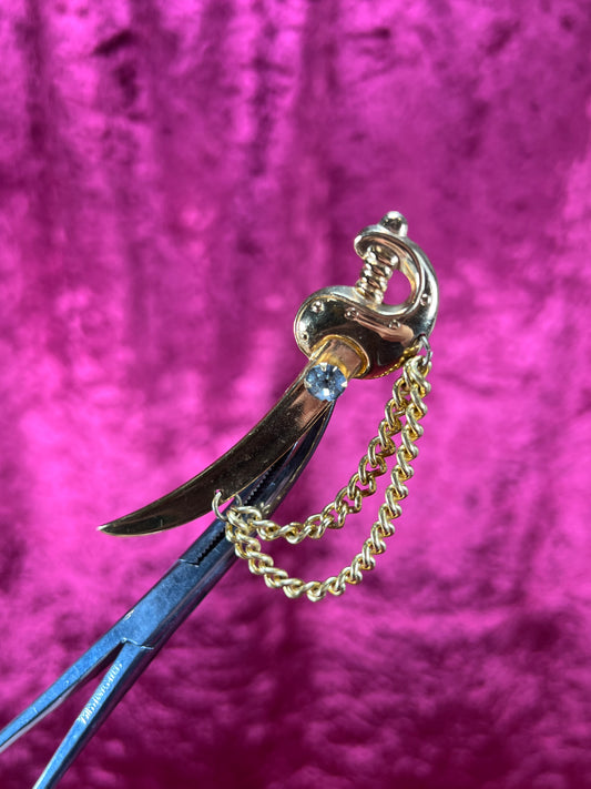 Vintage Jewelry - Brooch - Gold Tone Scimitar Sabre / Sword - Clear Rhinestone Center - Coro