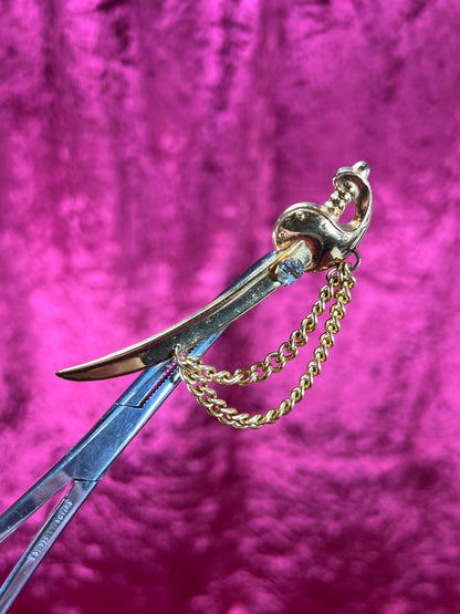 Vintage Jewelry - Brooch - Gold Tone Scimitar Sabre / Sword - Clear Rhinestone Center - Coro